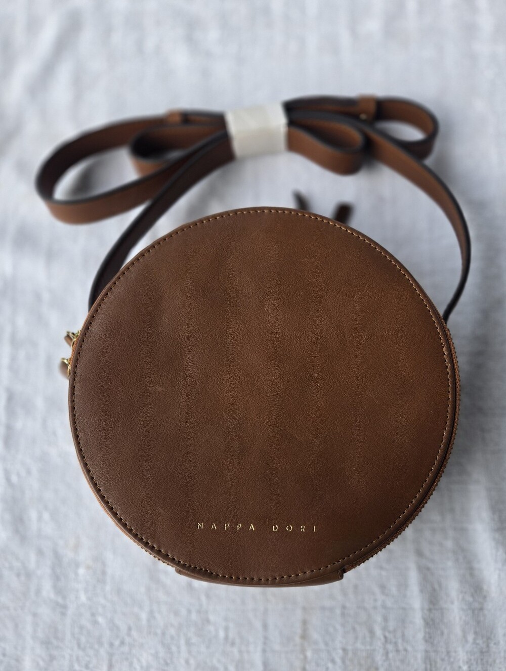 NAPPA DORI  Tan Round Crossbody Bag with Gold Hardware